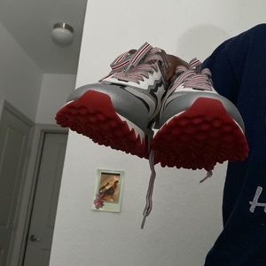 Louboutin red bottom sneakers